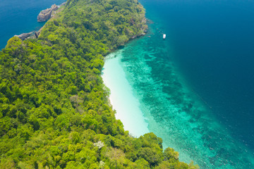 Aerial view from a drone of beautiful Nyaung Oo Phee island on sunny day in Myanmar.