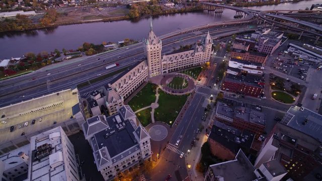 Albany New York Aerial v20 Panning birdseye detail over historical landmark building at dusk with Hudson river view - October 2017