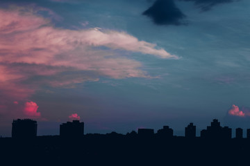 Fototapeta premium Sunset at buildings silhouette skyline at brazilian city