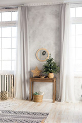new year's interior. mirror on the wall above the table. Christmas tree on the table. nightlight in...