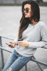 Beautiful girl posing in the street. Urban style. Street fashion.