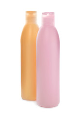 Bottles with cosmetic products on white background. Mockup for design