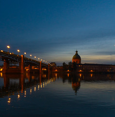 Naklejka na ściany i meble View of Chapelle Saint-Joseph and bridge Pont Saint-Pierre from the square Place Saint-Pierre at Sunset in Toulouse France