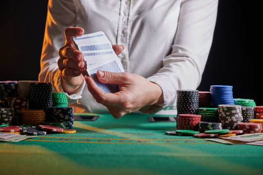 Croupier At The Gaming Table In A Casino. Gaming Business Black Jack, Poker.