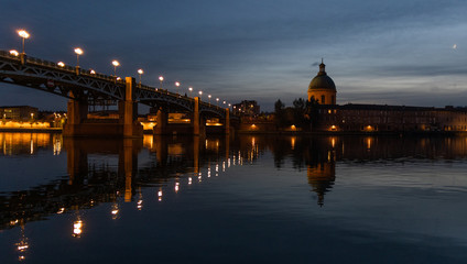 View of Chapelle Saint-Joseph and bridge Pont Saint-Pierre from the square Place Saint-Pierre at Sunset in Toulouse France - obrazy, fototapety, plakaty