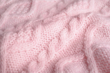 Fototapeta na wymiar Pink knitted sweater as background, closeup view