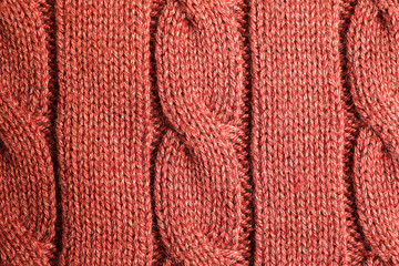 Brown knitted sweater as background, closeup view