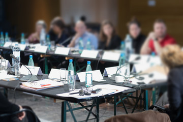 glasses and bottles at conference table