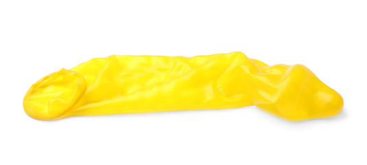 Yellow used condom on white background. Safe sex concept