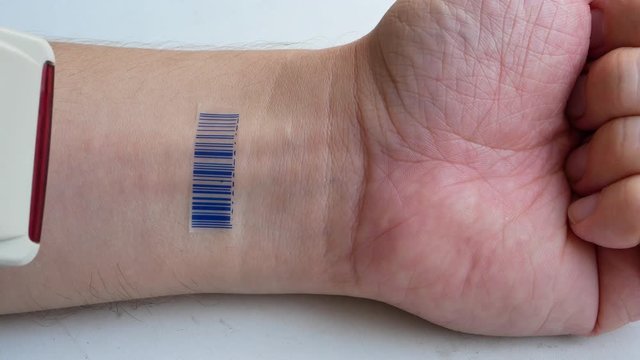human with implant micro chip scanning barcode imprinted on his hand. future technology identification or human as a goods concept. 4k UHD video footage