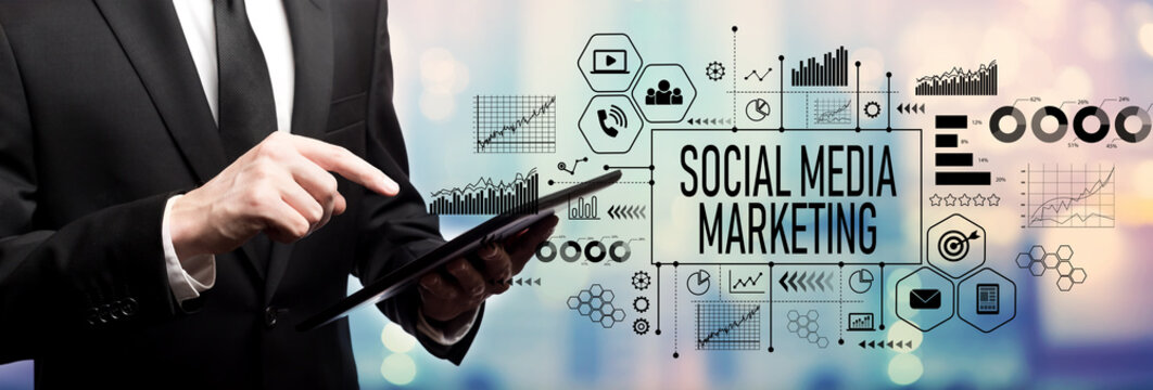 Social media marketing concept with businessman using his tablet computer
