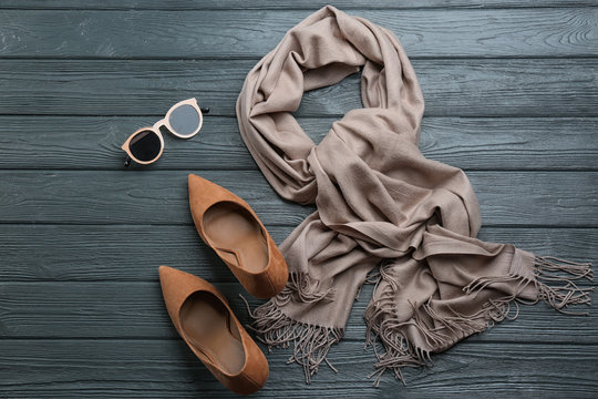 Flat lay composition with clothes on dark wooden background