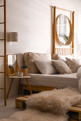 Stylish modern room interior with  comfortable bed © New Africa