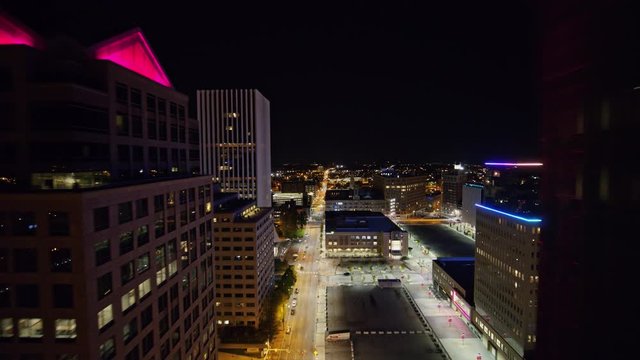 Rochester New York Aerial v8 Fly thru of downtown over S Clinton Street at night - October 2017