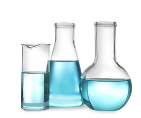 Glassware with liquids isolated on white. Laboratory analysis