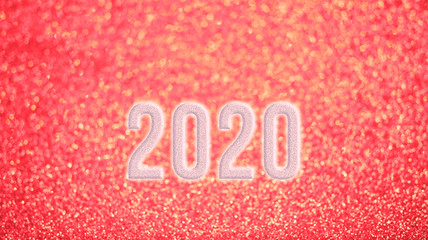 Happy new year 2020 with blur pink glitter background