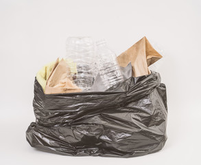 Trash bag with recycle garbage on white background