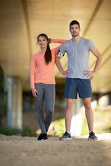 Young,beautiful and happy couple standing outdoors