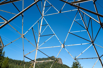 Hamilton Mountain viewed through a high voltage tower in Beacon Rock State Park, Washington, USA