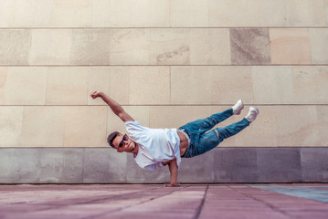 Superman flight, male acrobat dancer, handstand, dancing breakdance, summer city, free space text,...