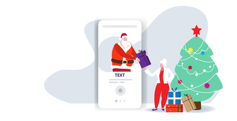 santa claus from smartphone screen giving present gift box to senior mature woman merry christmas happy new year holiday celebration concept online mobile app horizontal full length vector