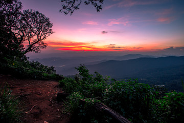 Natural scenery background, high angle on the top of the hill, can see a variety of mountains, various plants, blurred through the wind while watching nature, seen in rural tourist attractions.