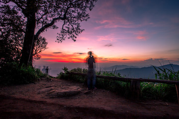 Natural scenery background, high angle on the top of the hill, can see a variety of mountains, various plants, blurred through the wind while watching nature, seen in rural tourist attractions.