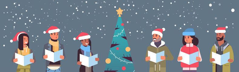 mix race people reading books merry christmas happy new year holiday celebration concept men women wearing santa hats standing near fit tree horizontal portrait vector illustration