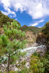 Suspention bridge on the Everest Base Camp Trek, Himalaya mountains, Sagarmatha National Park, Nepal.