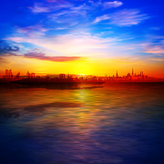 Fototapeta na wymiar abstract spring background with gold sunrise blue sky and silhouette of city