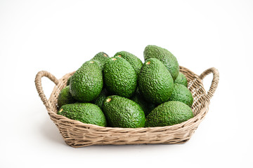 Avocado Fresh green  In white background - in a basket