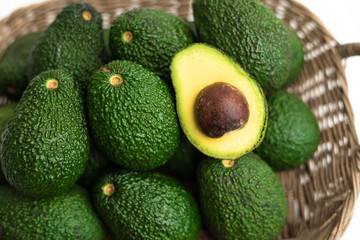 Avocado Fresh green  In white background - in a basket