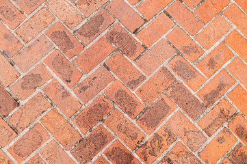Old red brick texture background, herringbone brick pattern retro grungy wallpaper