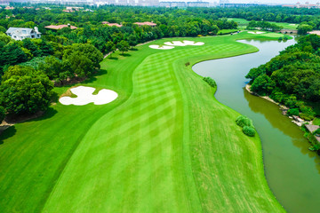 Aerial view of golf course and water