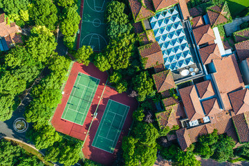 Aerial view of a beautiful green golf course with residential architecture.