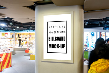 Mock up large vertical billboard in fashion store