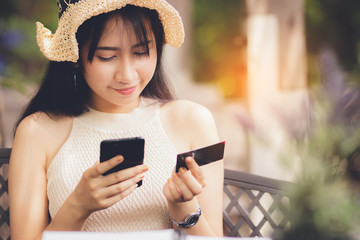 Asia woman using smartphone working ,playing in free time with happy.