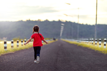 little girl playing in the nature with happy.