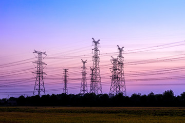 Electricity tower silhouette and sky landscape at dusk