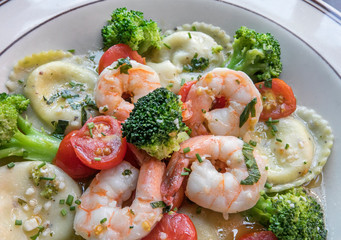 shrimps , ravioli, and vegetables