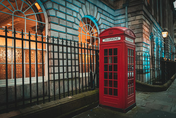 Traditional and iconic old red telephone box in London UK. - Powered by Adobe