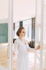 Girl in boudoir dress in European style. Morning bride in the interior Studio.