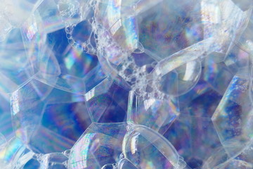 soap foam macro background.blue texture of soap foam close-up. Bath foam. Ease.Lightness and airiness.Foamy Cleaner Background.Cleanliness concept
