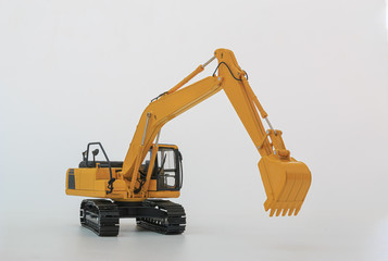 Yellow excavator  model, machinery in heavy industry with isolated on  a white background