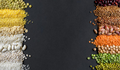 Dry Cereals and legumes on black background.