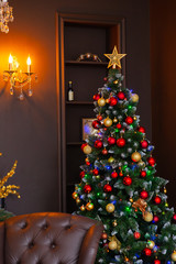 Beautiful green christmas tree with decorations. New Year 2020.