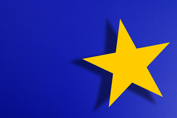 Yellow star shape on blue background