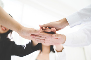 Business team teamwork join hands partnership concept
