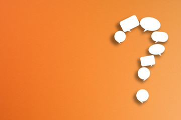 Question mark made from speech bubbles with copy space on orange background