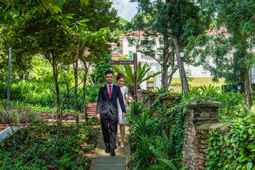 Asian loving couple pre-wedding outdoor photo shoot. Casual natural real people portraits. Loving romantic couple.